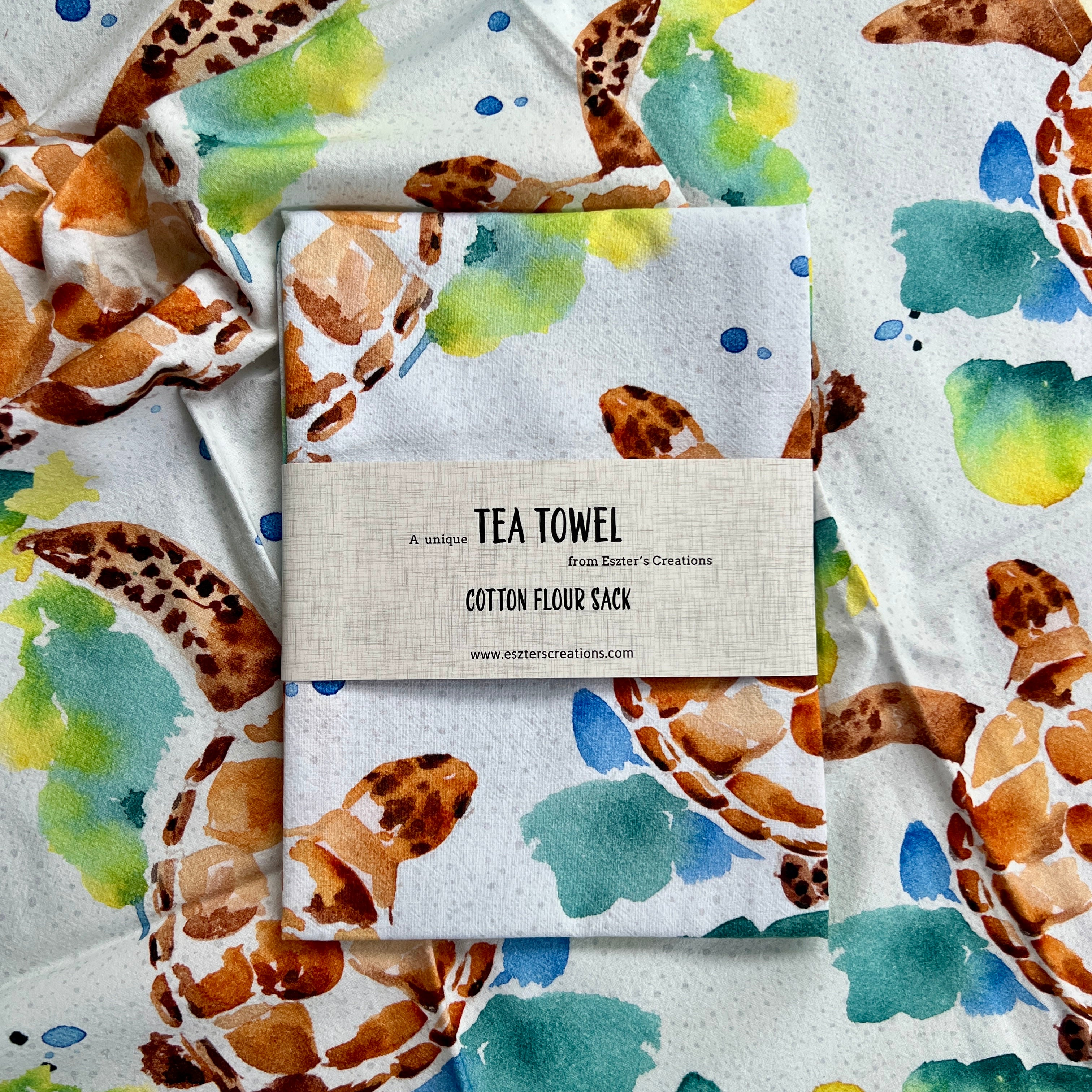 Green turtle cotton teatowel with watercolour turtles swimming in tropical waters