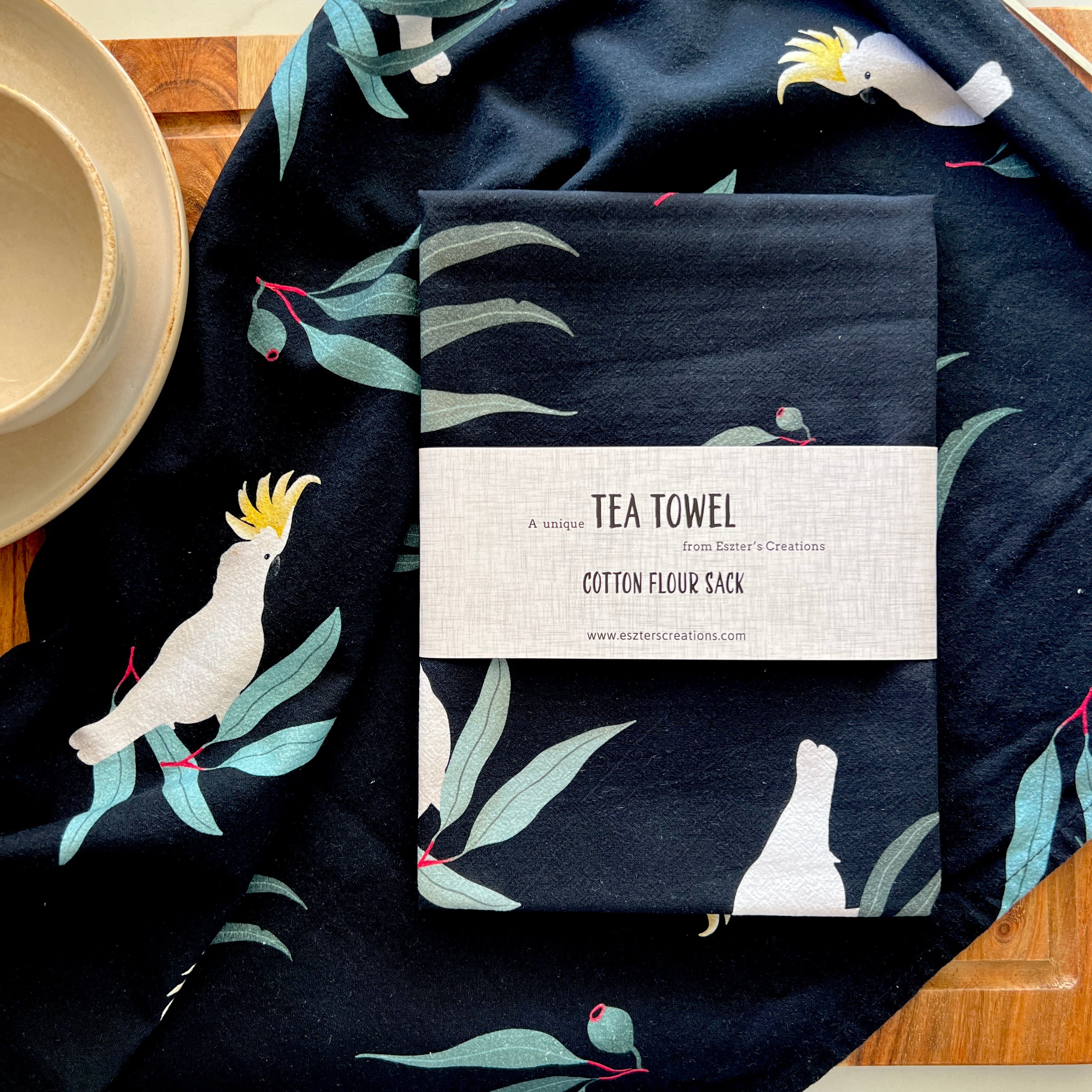 Cockatoo on black tea towel
