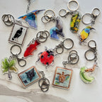 Collection of various Australian animal-themed keychains on a light background