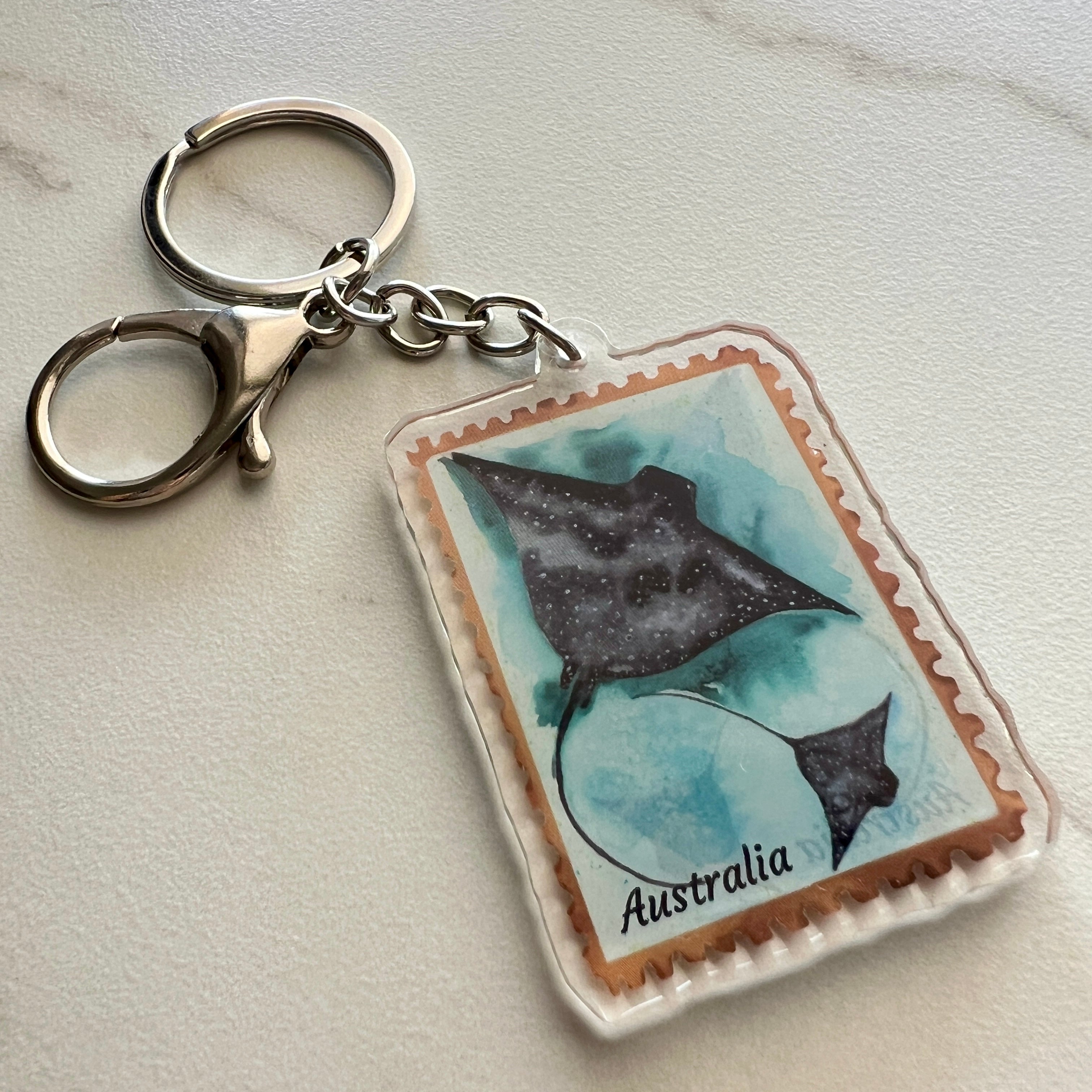 Keychain with a design of two stingrays on an Australia postage stamp