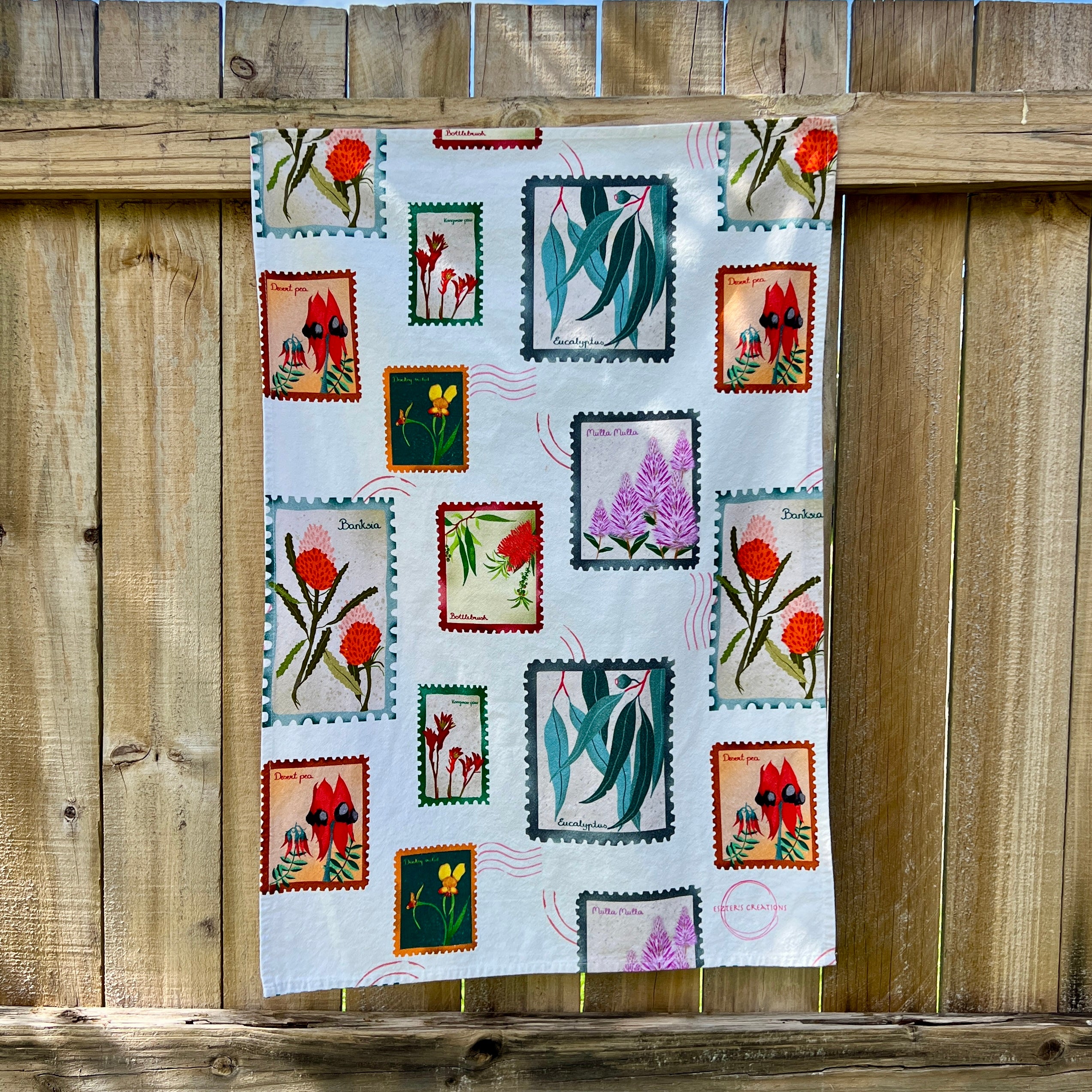 wildflower stamp tea towel on light cotton background by Eszter Torok