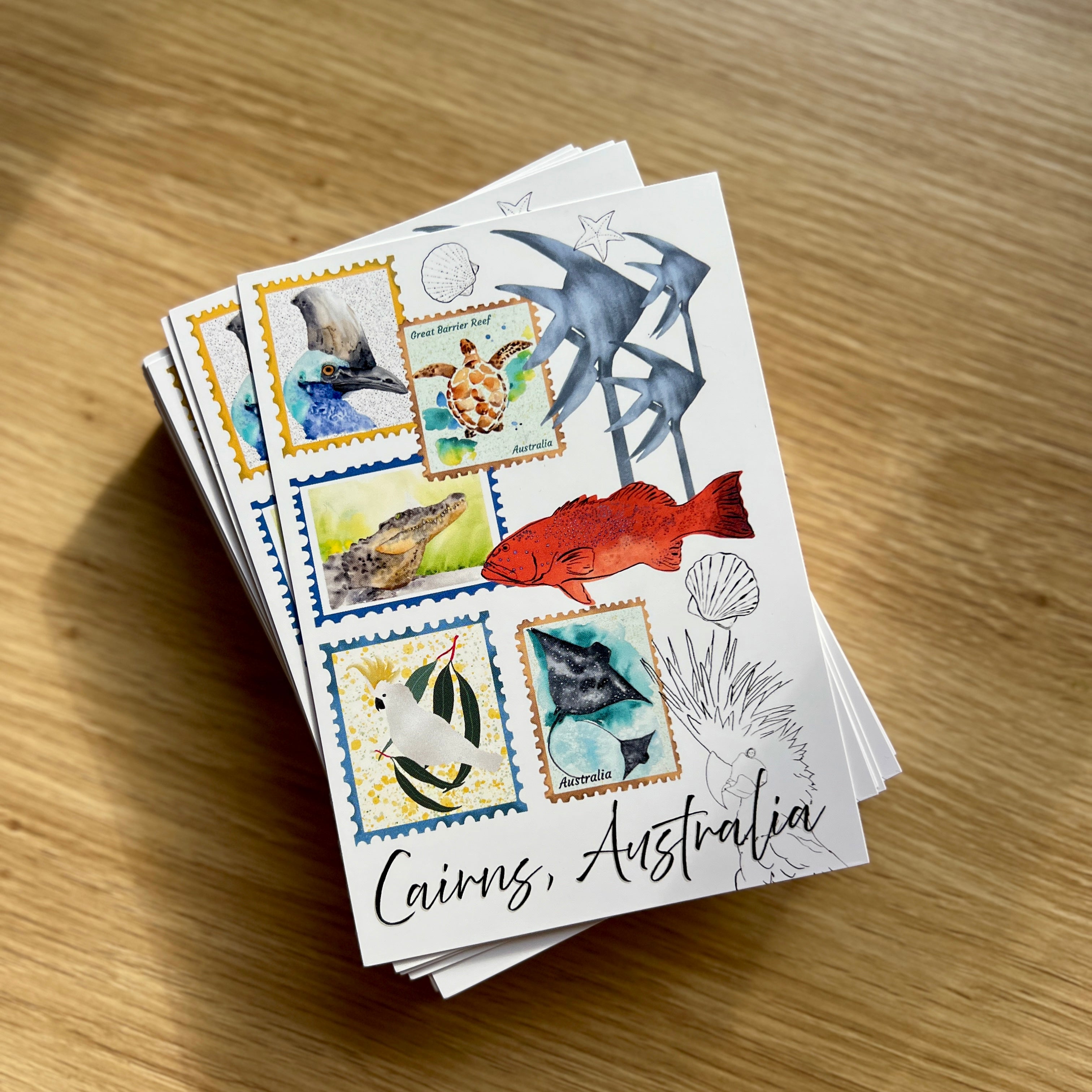 Cairns Australia postcards featuring wildlife such as cassowary, turtle, trout, crocodile, stingray, cockatoo.