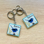 Acrylic keychain with Cairns bird featuring local artist' work.