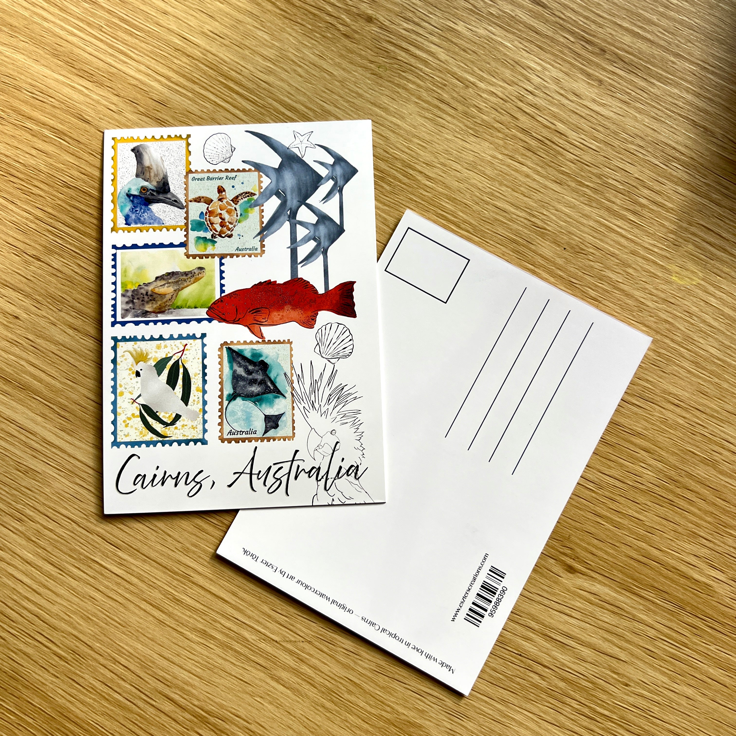 Postcard with illustrations of marine life and 'Cairns, Australia' text by local artist.