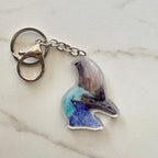 Keychain with a cassowary design on a marble surface