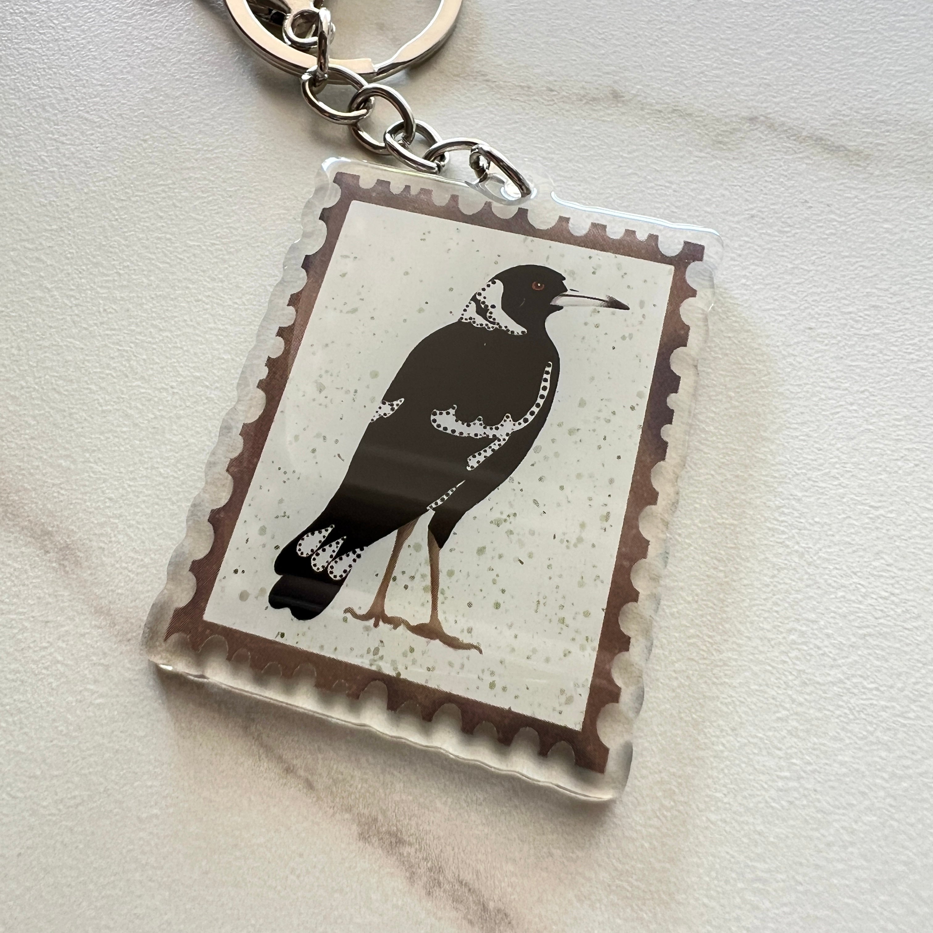 keyring featuring a black and white magpie by eszter's creations