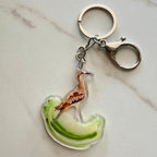 Keychain with a curlew design on a light gray background