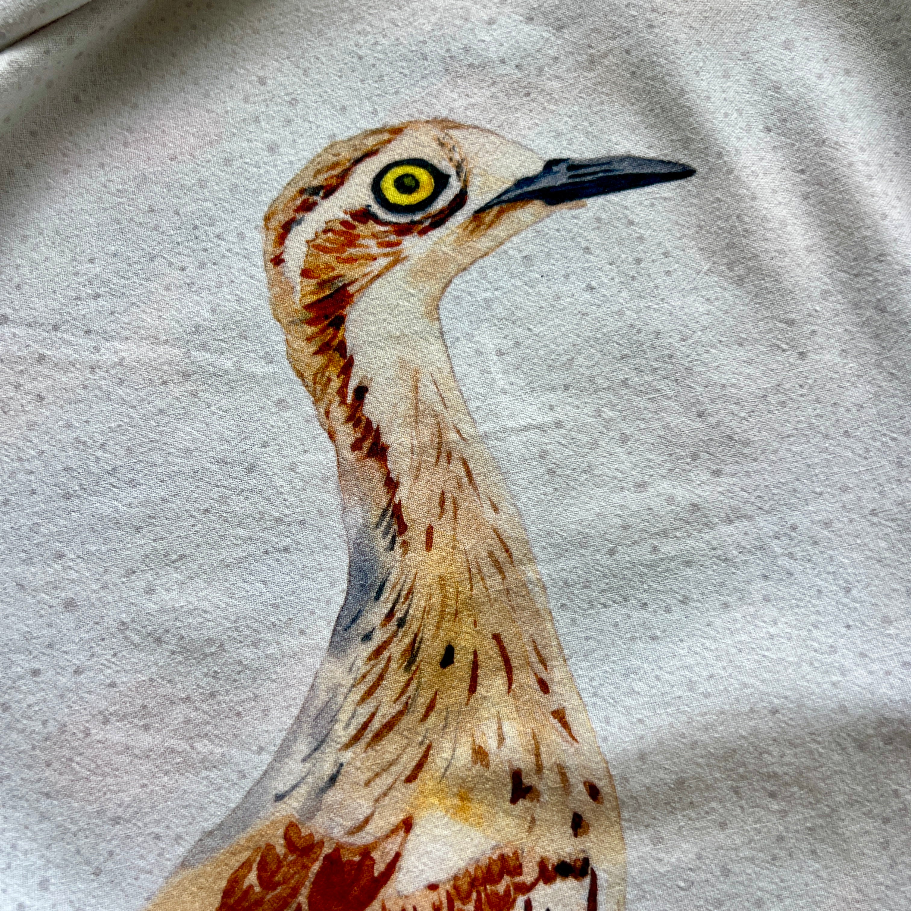 Close-up of a bird with detailed feather patterns on cotton tea towel