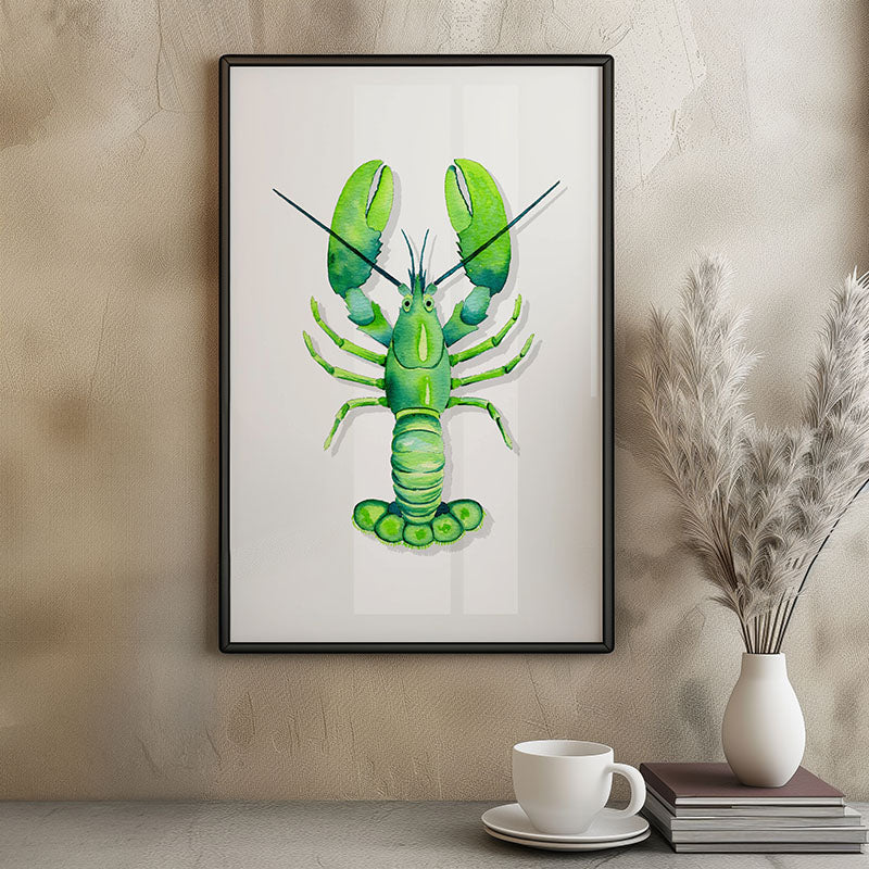 A framed art print featuring a vibrant green lobster on a white background, styled on a textured beige wall above a coffee table with a white cup, books, and a vase of pampas grass.