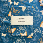 Tea towel with butterfly pattern on a matching fabric background