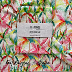 Tea towel with colorful pink, vibrant palm tree pattern and 'Port Douglas, Australia' text.