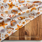 seashell patterened soft cotton teatowel for port douglas gift